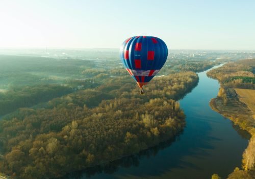 balloon-in-the-sky-over-the-river-and-forest-fog-on-the-background.jpg